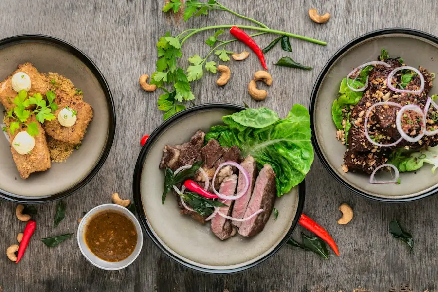 A table spread with steak, salad and toast